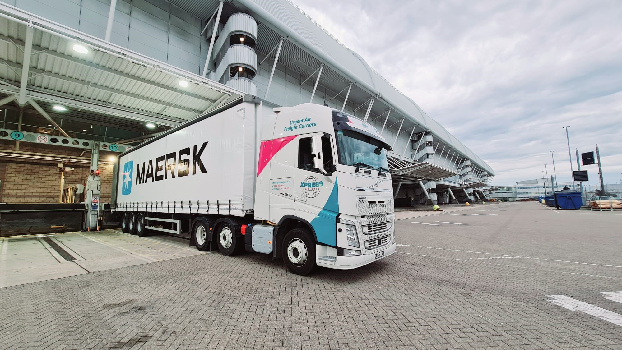 Xpress truck at an airport loading bay
